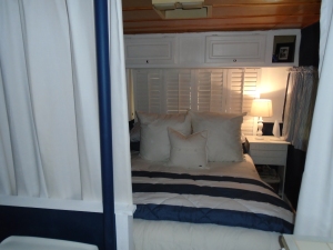 Shutter Headboard closed with dollar store lamp and nightstand - complete privacy found! 